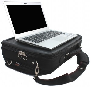 A large trabasack laptray and bag shown in black with a laptop on it's tray surface but it could easily fit an XAC on the tray surface