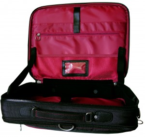 Image shows the Trabasack Max opened-up with red satin lining