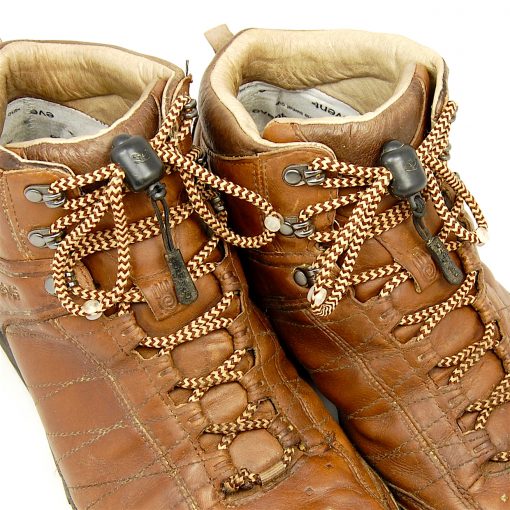 Photograph of brown hiking boots fastened with beige and brown Greeper Hikers laces