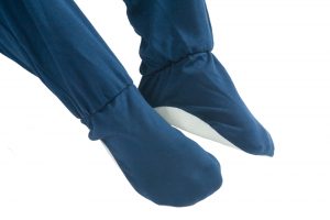 Image shows a photograph of the built-in non-sleep feet on a navy blue Seenin sleepsuit