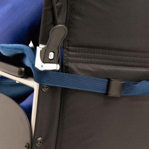 Image shows a photograph of the back of a wheelchair, showing the fleece leg cover strap attached around the back of the chair