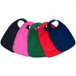 Image shows a photograph of 5 cotton aprons in the colours black, cerise, green, red and navy blue, lay flat in a fan-shape on a white background