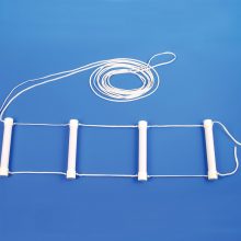 Image is a photograph of a white Buckingham Bed Rope Ladder with 4 large rungs lay flat on a blue background