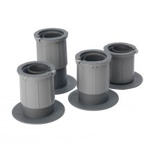 Image shows a photograph of 4 grey plastic chair/bed raisers at various heights on a white background