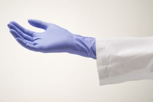 Image shows an upturned hand wearing a light violet nitrile medical glove